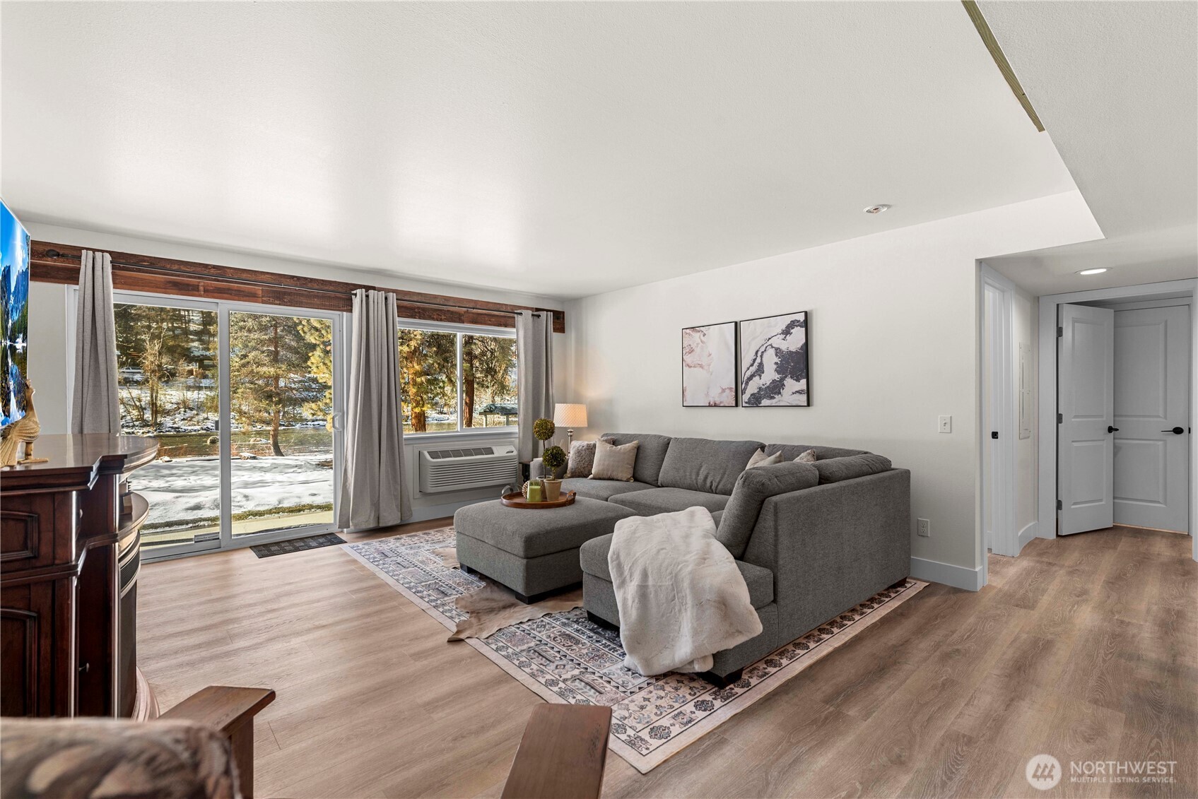 8348 Main Street, Unit 6 Peshastin, WA 98847 - Photo 10 of 34 a living room with furniture large window and wooden floor
