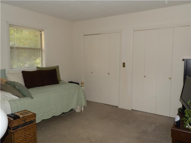 2100 Post Road Clarksville, TN 37043 - Photo 10 of 19 a bedroom with a bed and a potted plant on the dresser