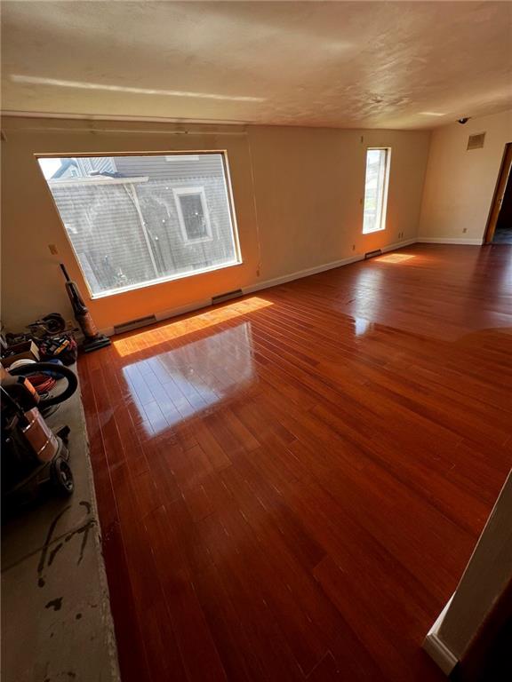 216 East Pike Street Houston, PA 15342 - Photo 7 of 10 a view of an empty room with wooden floor and a window