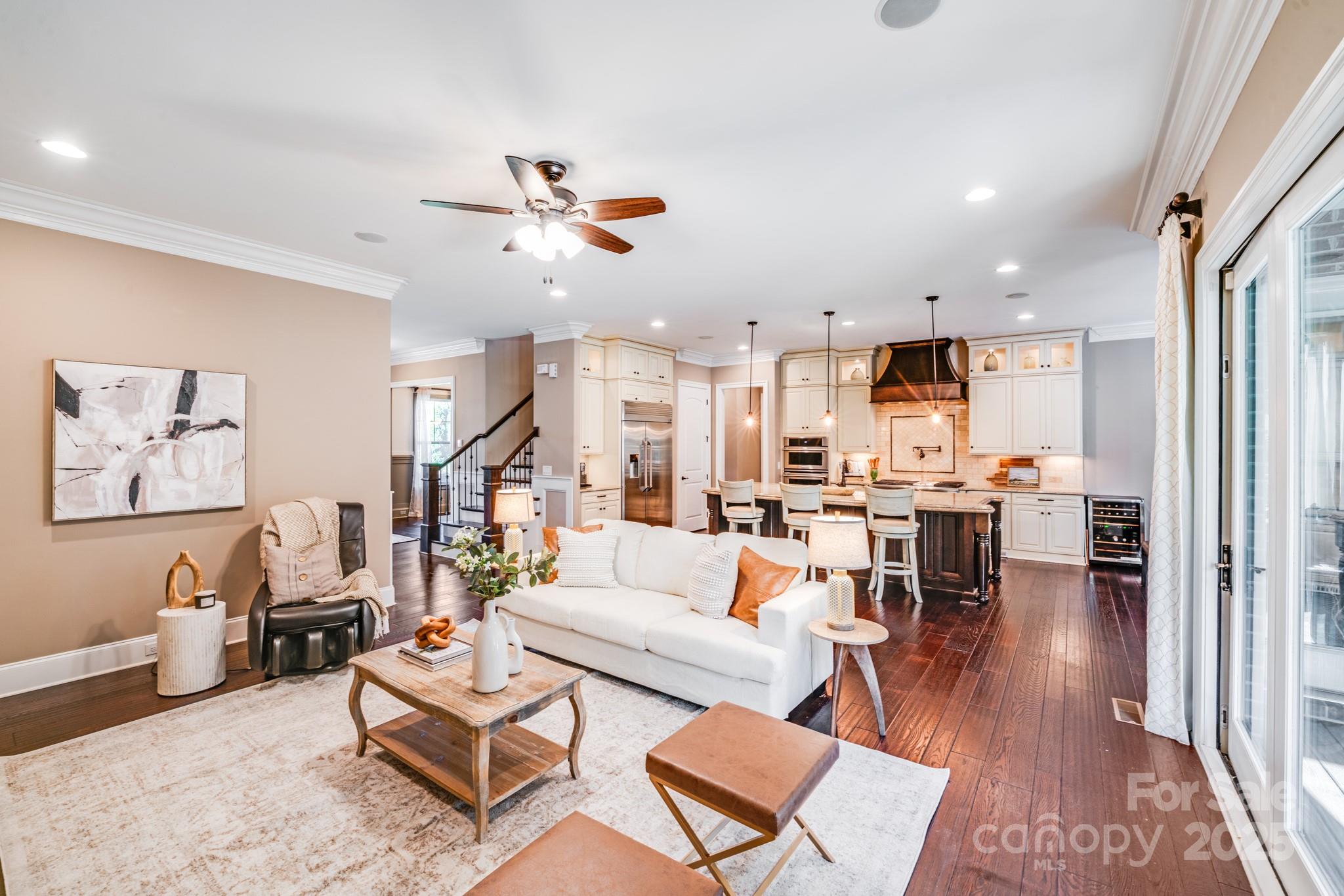 126 Forsythia Lane Tega Cay, SC 29708 - Photo 12 of 32 a living room with furniture kitchen view and a wooden floor