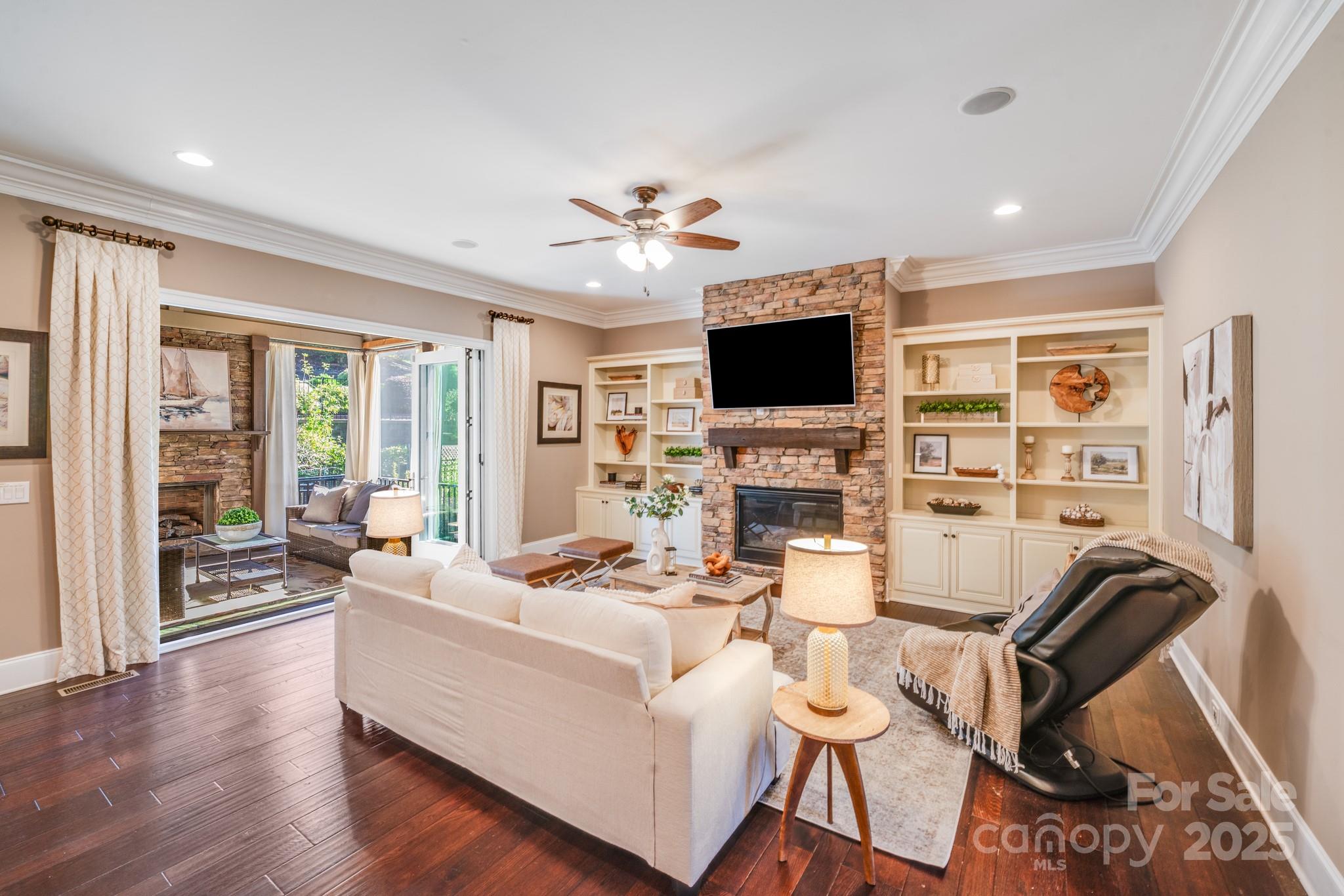 126 Forsythia Lane Tega Cay, SC 29708 - Photo 13 of 32 a living room with furniture a fireplace and a flat screen tv