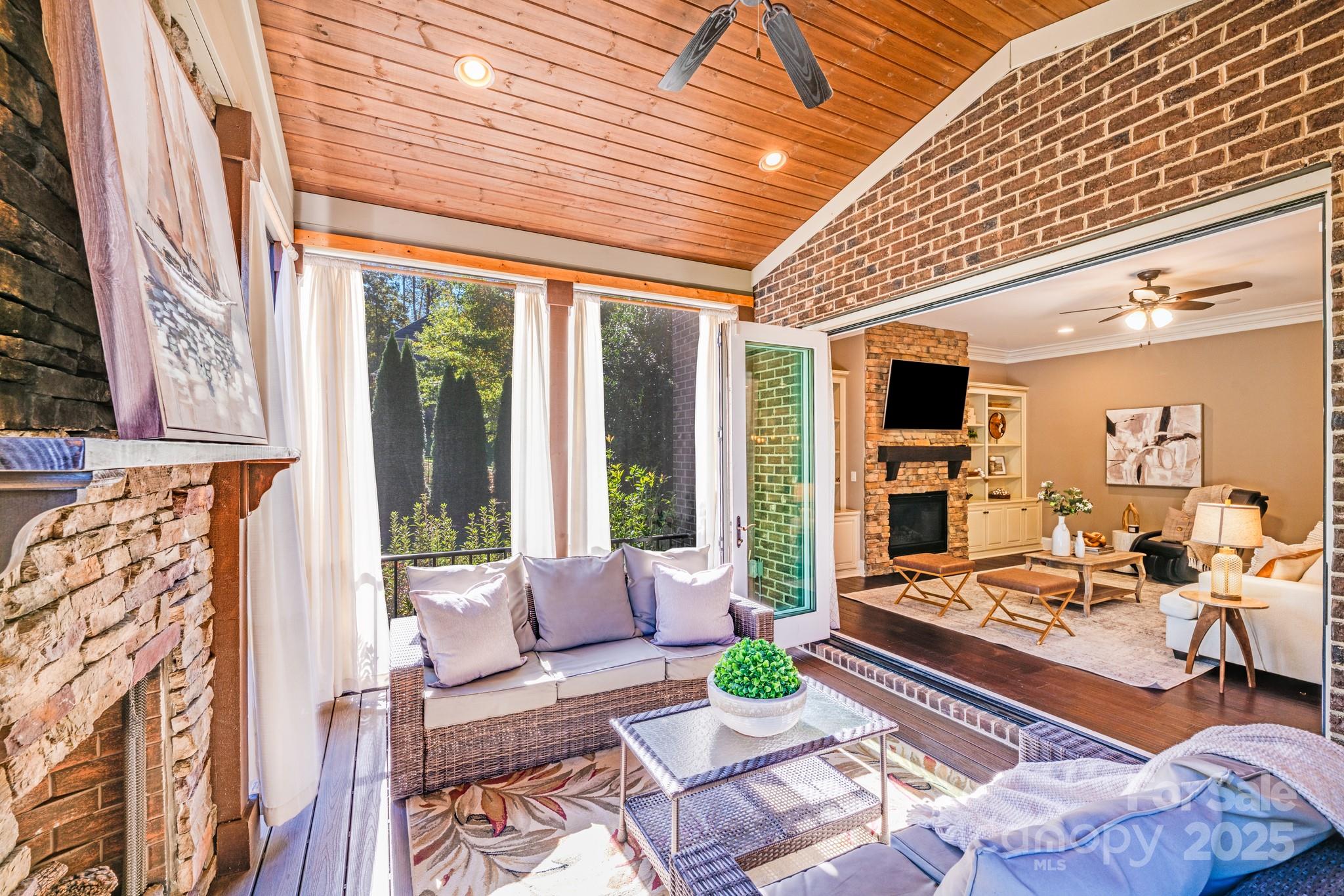126 Forsythia Lane Tega Cay, SC 29708 - Photo 15 of 32 a living room with fireplace furniture and a large window