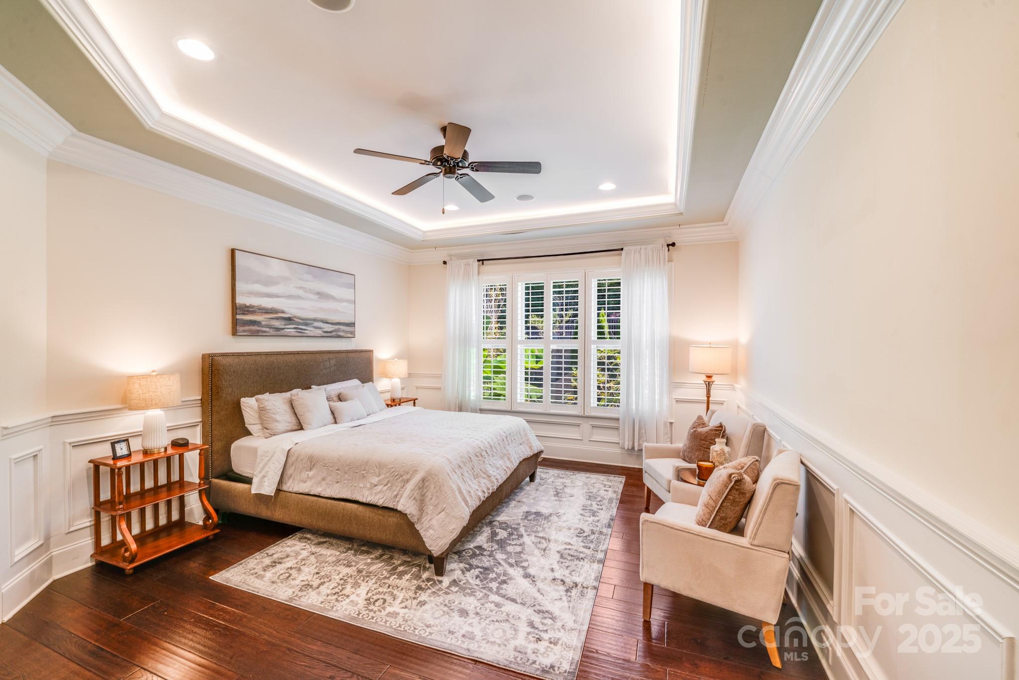 126 Forsythia Lane Tega Cay, SC 29708 - Photo 16 of 32 a bedroom with a bed a couch and a window