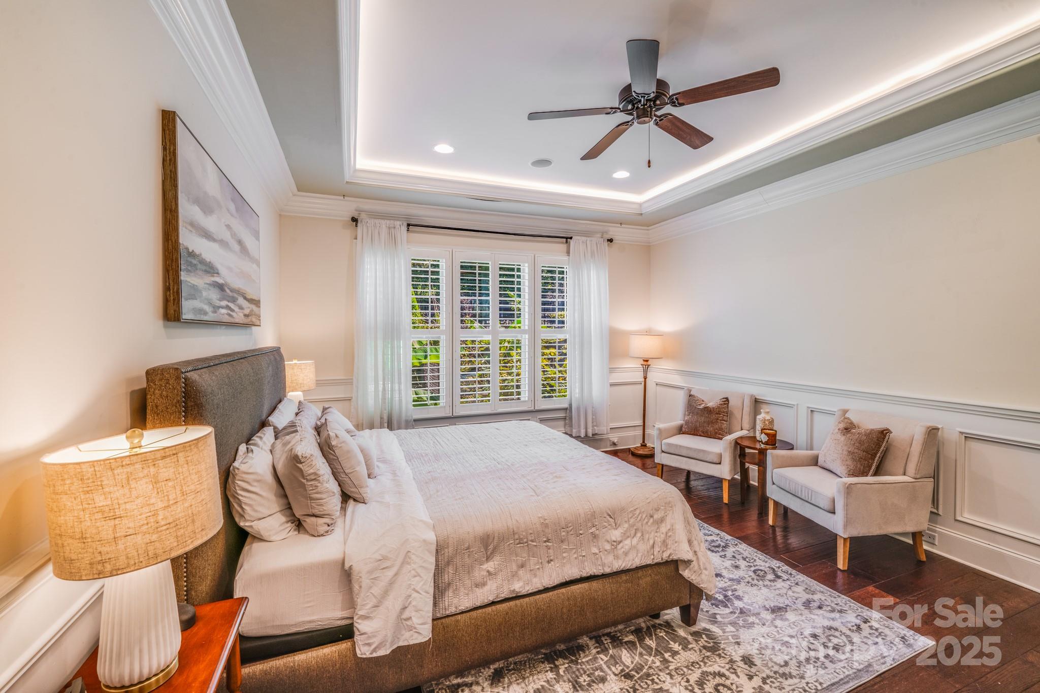 126 Forsythia Lane Tega Cay, SC 29708 - Photo 17 of 32 a spacious bedroom with a bed and a chair