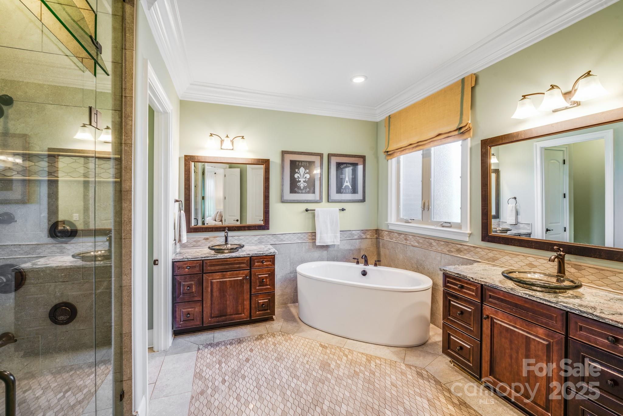 126 Forsythia Lane Tega Cay, SC 29708 - Photo 18 of 32 a bathroom with a tub double vanity sink and mirror