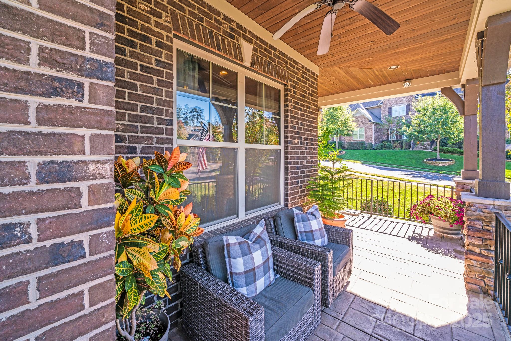 126 Forsythia Lane Tega Cay, SC 29708 - Photo 2 of 32 a view of a chairs and table in the patio