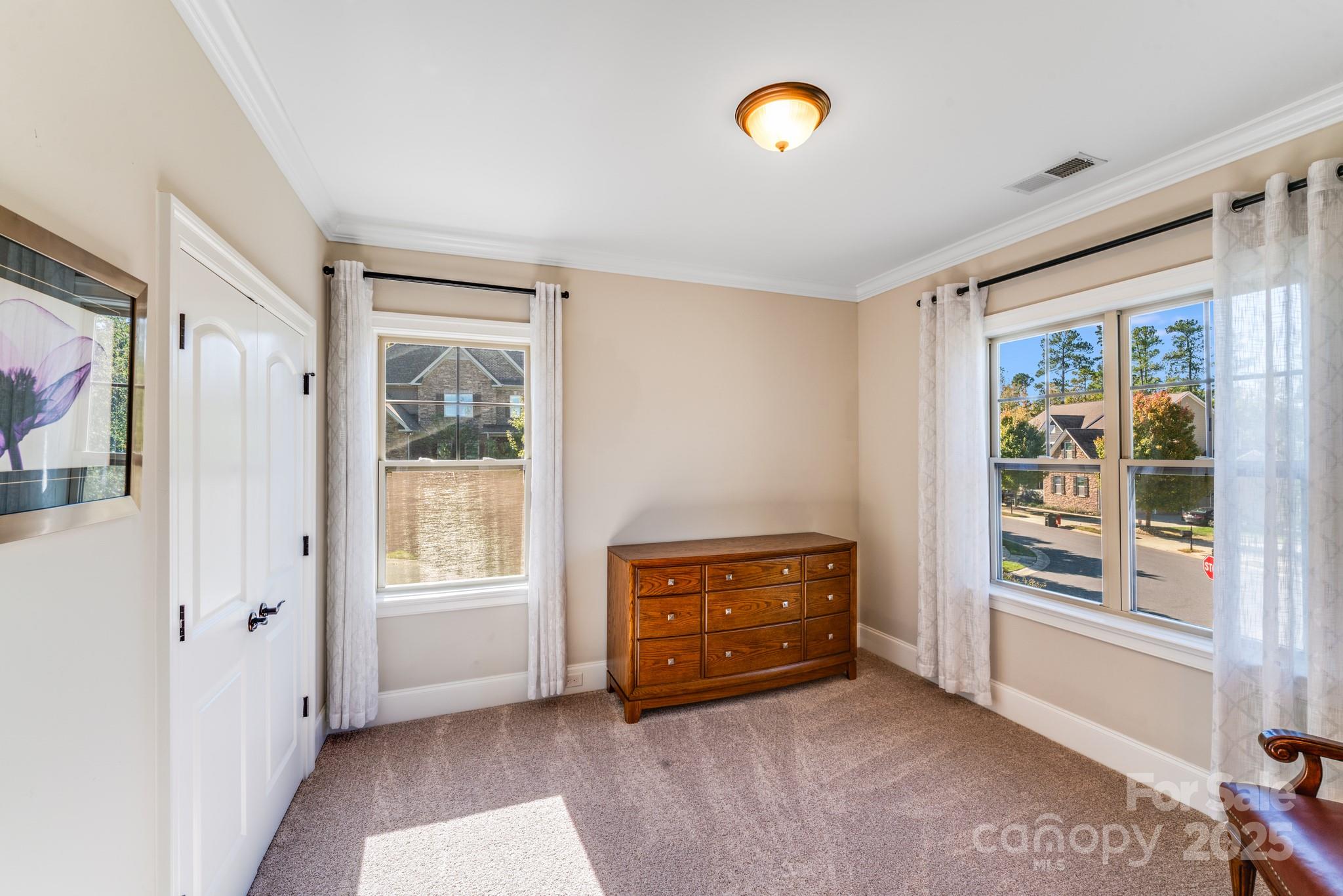126 Forsythia Lane Tega Cay, SC 29708 - Photo 23 of 32 a view of room with windows and cabinet