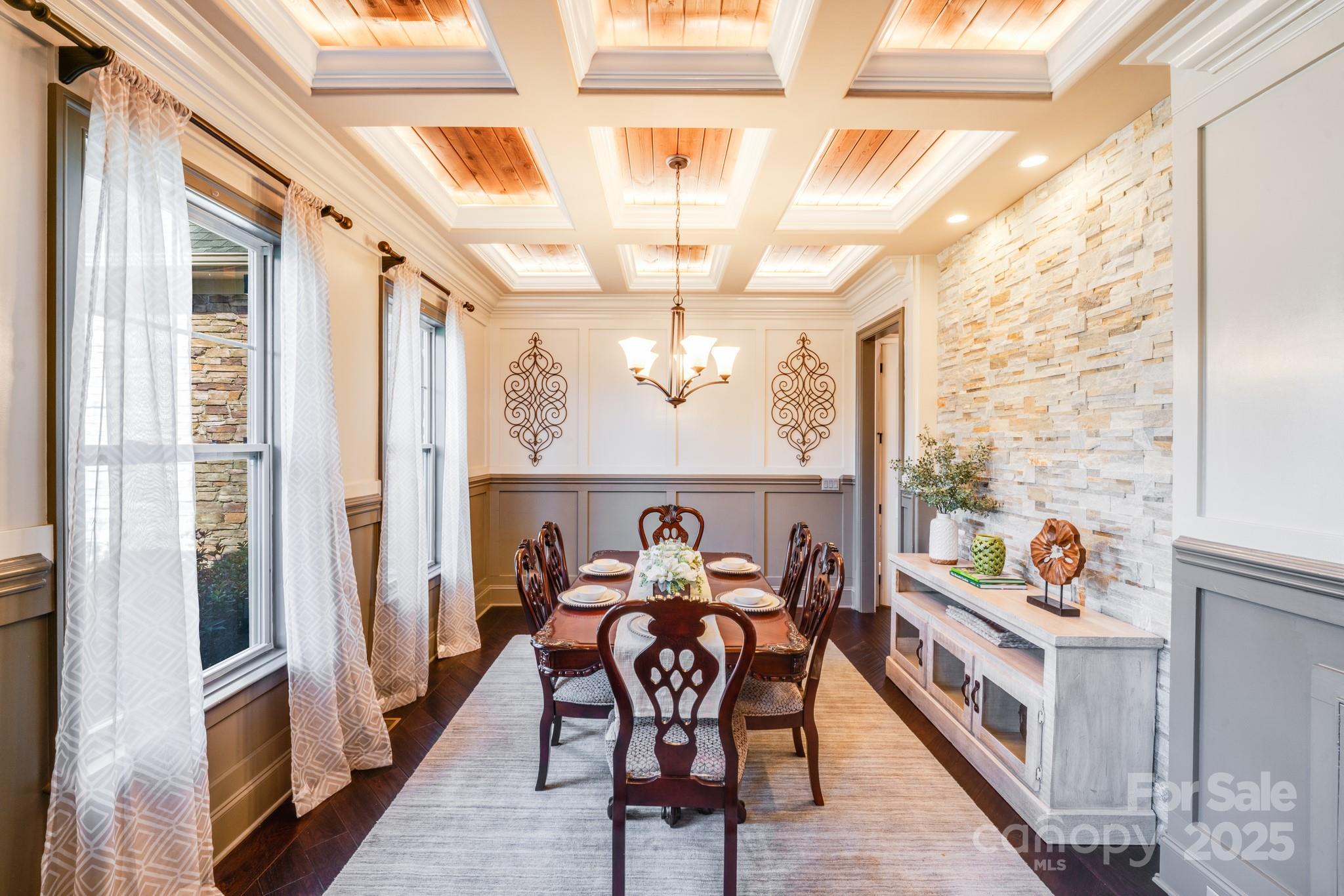126 Forsythia Lane Tega Cay, SC 29708 - Photo 5 of 32 a view of a dining room with furniture a chandelier and a window