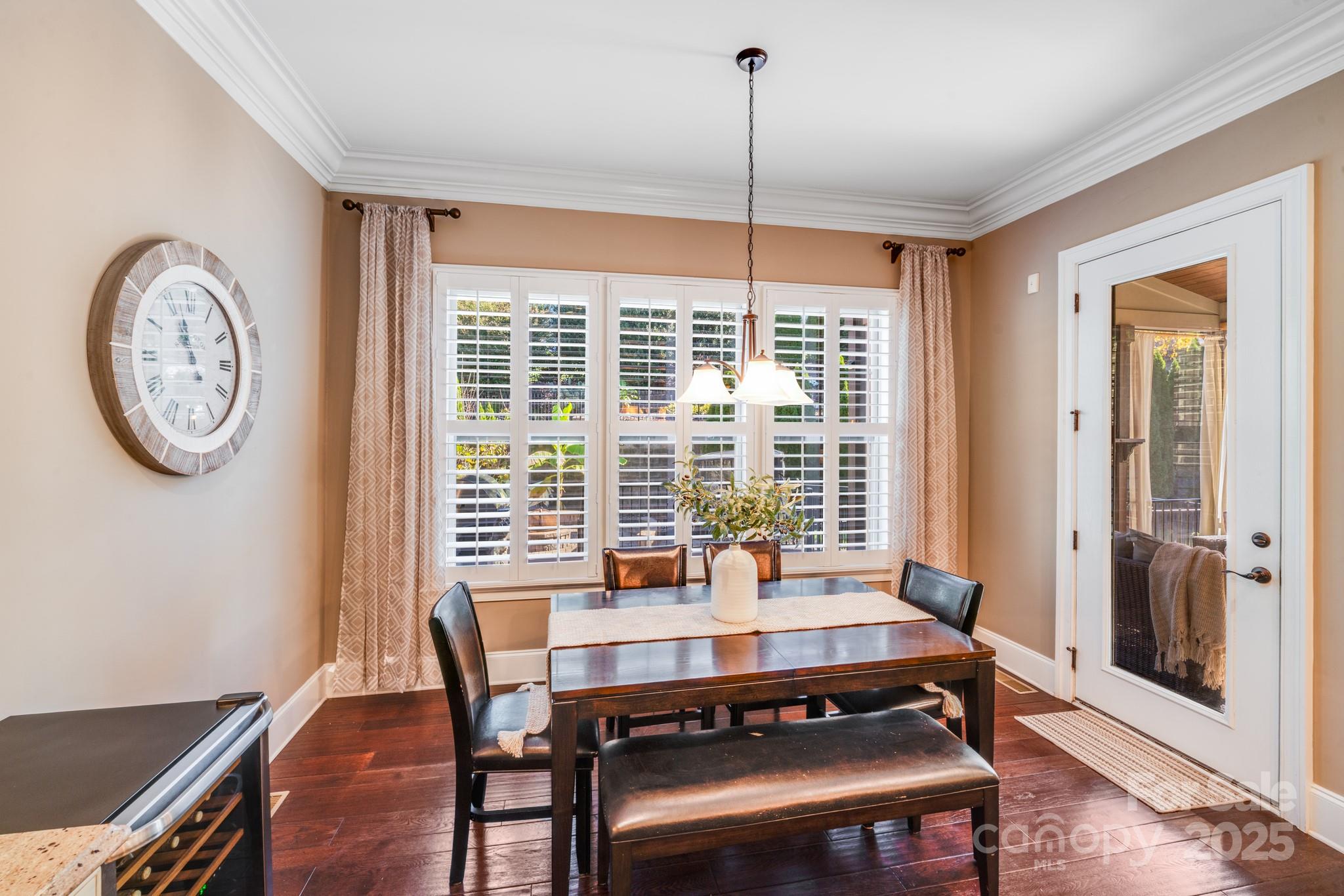 126 Forsythia Lane Tega Cay, SC 29708 - Photo 10 of 32 a view of a dining room with furniture window and wooden floor