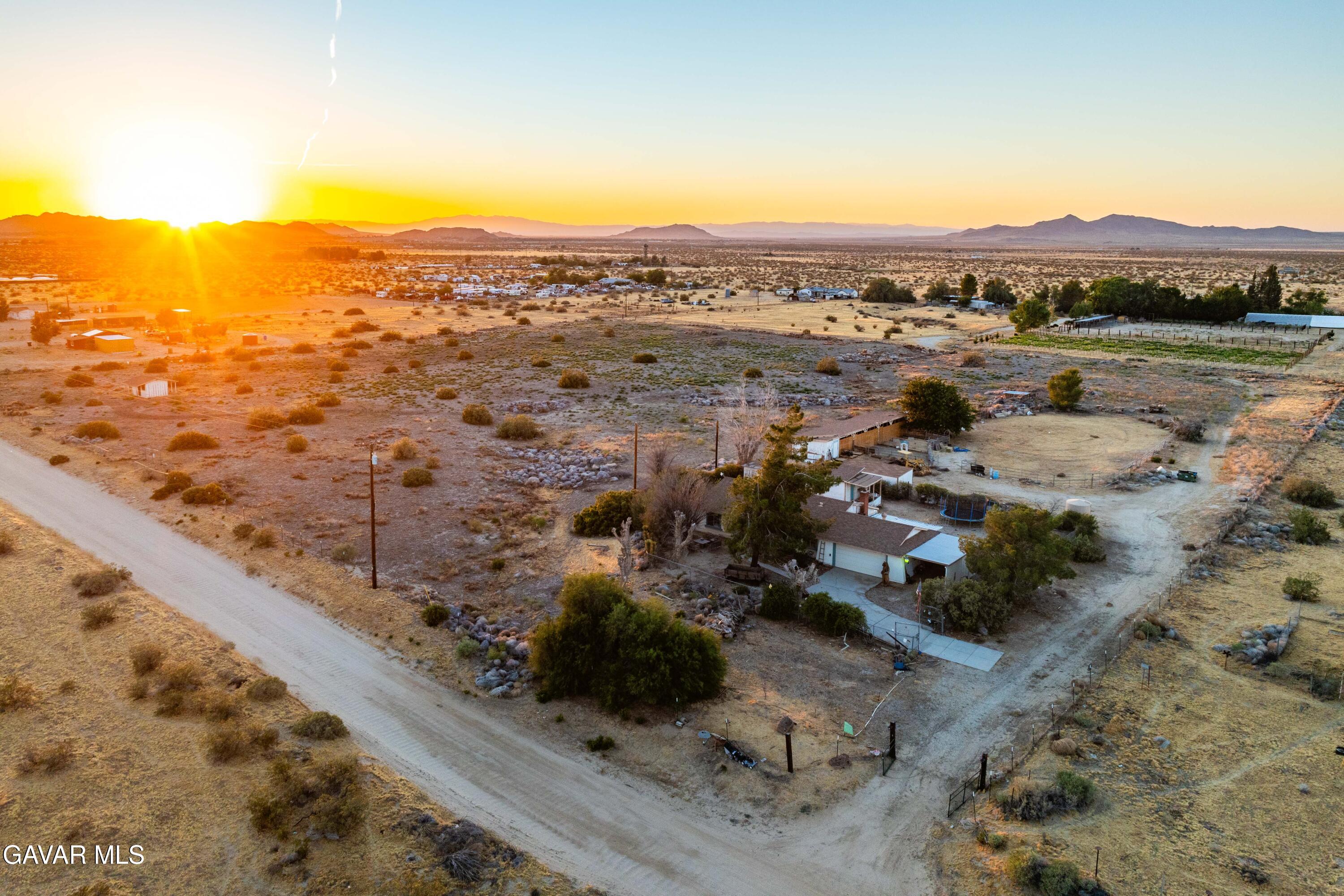 20539 East Ave R Palmdale, CA 93591 - Photo 1 of 55 a view of a city with mountains in the background