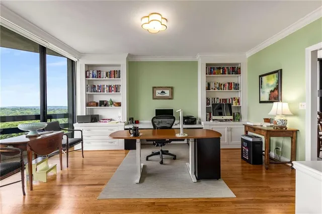 a living room with furniture a rug and a large window