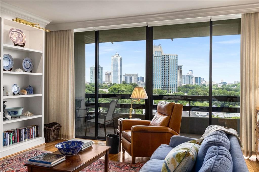 2660 Peachtree Road Northwest, Unit 16F Atlanta, GA 30305 - Photo 14 of 56 a living room with furniture and a floor to ceiling window