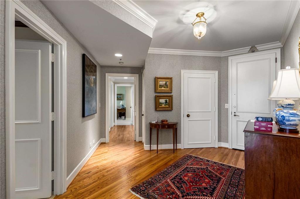 2660 Peachtree Road Northwest, Unit 16F Atlanta, GA 30305 - Photo 2 of 56 a living room with furniture and a wooden floor