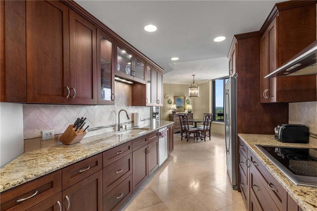 2660 Peachtree Road Northwest, Unit 16F Atlanta, GA 30305 - Photo 22 of 56 a kitchen with counter space cabinets and appliances