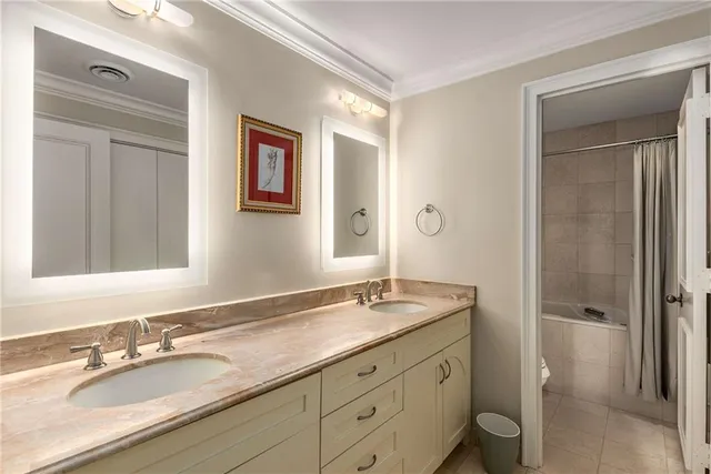 a bathroom with a granite countertop sink mirror and shower