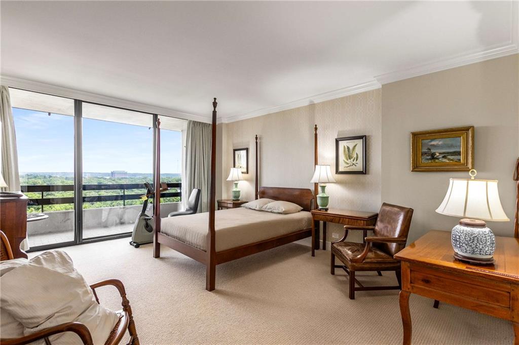 2660 Peachtree Road Northwest, Unit 16F Atlanta, GA 30305 - Photo 26 of 56 a bedroom with furniture and large windows