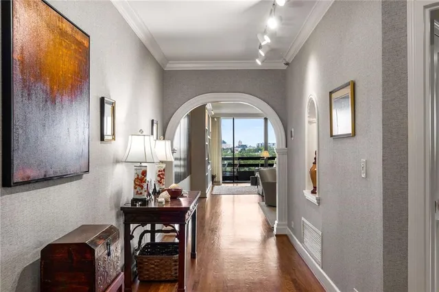 a view of a livingroom with furniture and hardwood floor