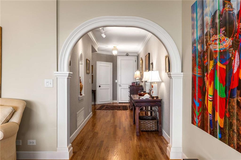 2660 Peachtree Road Northwest, Unit 16F Atlanta, GA 30305 - Photo 4 of 56 a view of a hallway view with wooden floor and furniture