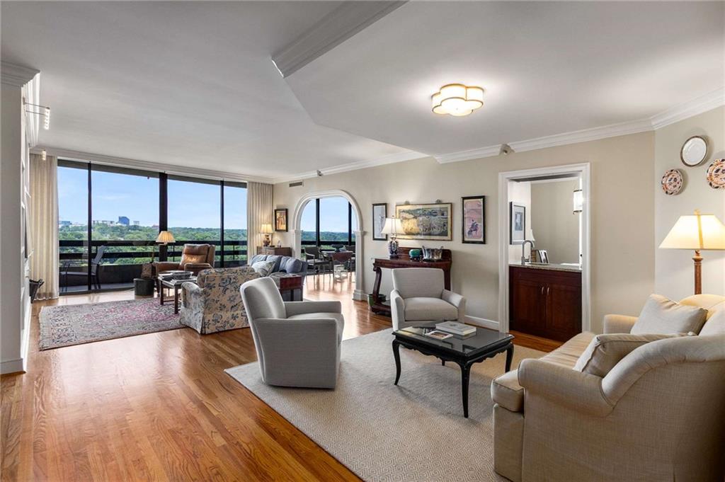 2660 Peachtree Road Northwest, Unit 16F Atlanta, GA 30305 - Photo 5 of 56 a living room with furniture and a large window