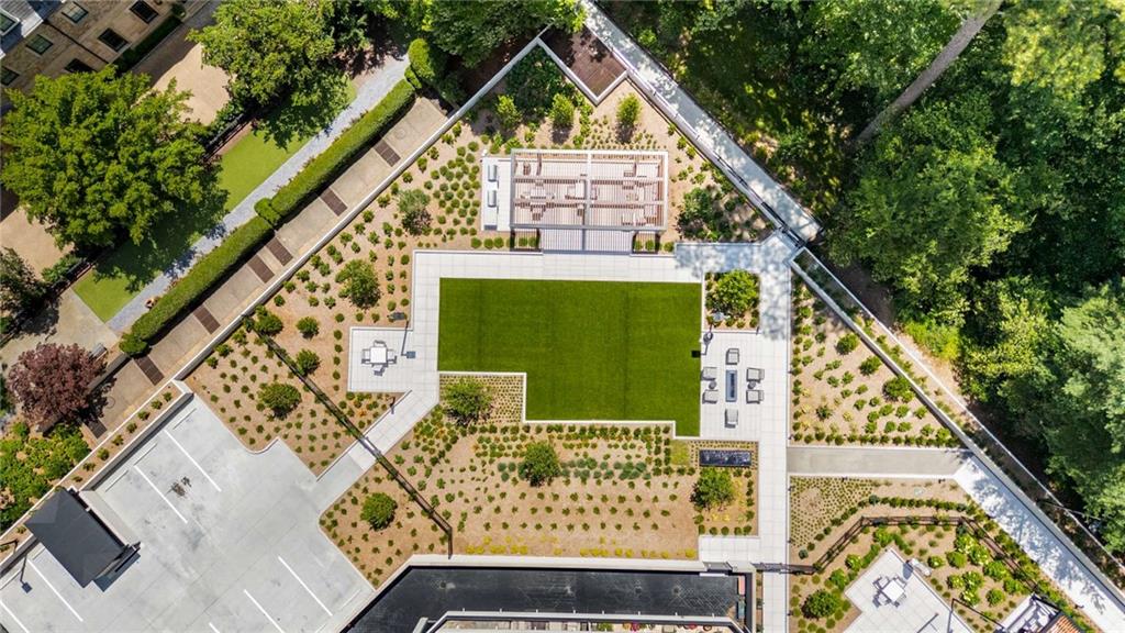 2660 Peachtree Road Northwest, Unit 16F Atlanta, GA 30305 - Photo 55 of 56 a front view of a house with a garden