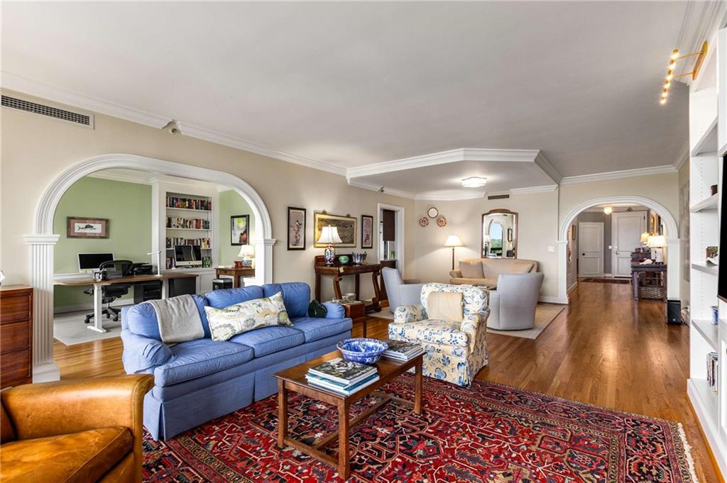 2660 Peachtree Road Northwest, Unit 16F Atlanta, GA 30305 - Photo 9 of 56 a living room with furniture a rug and a fireplace