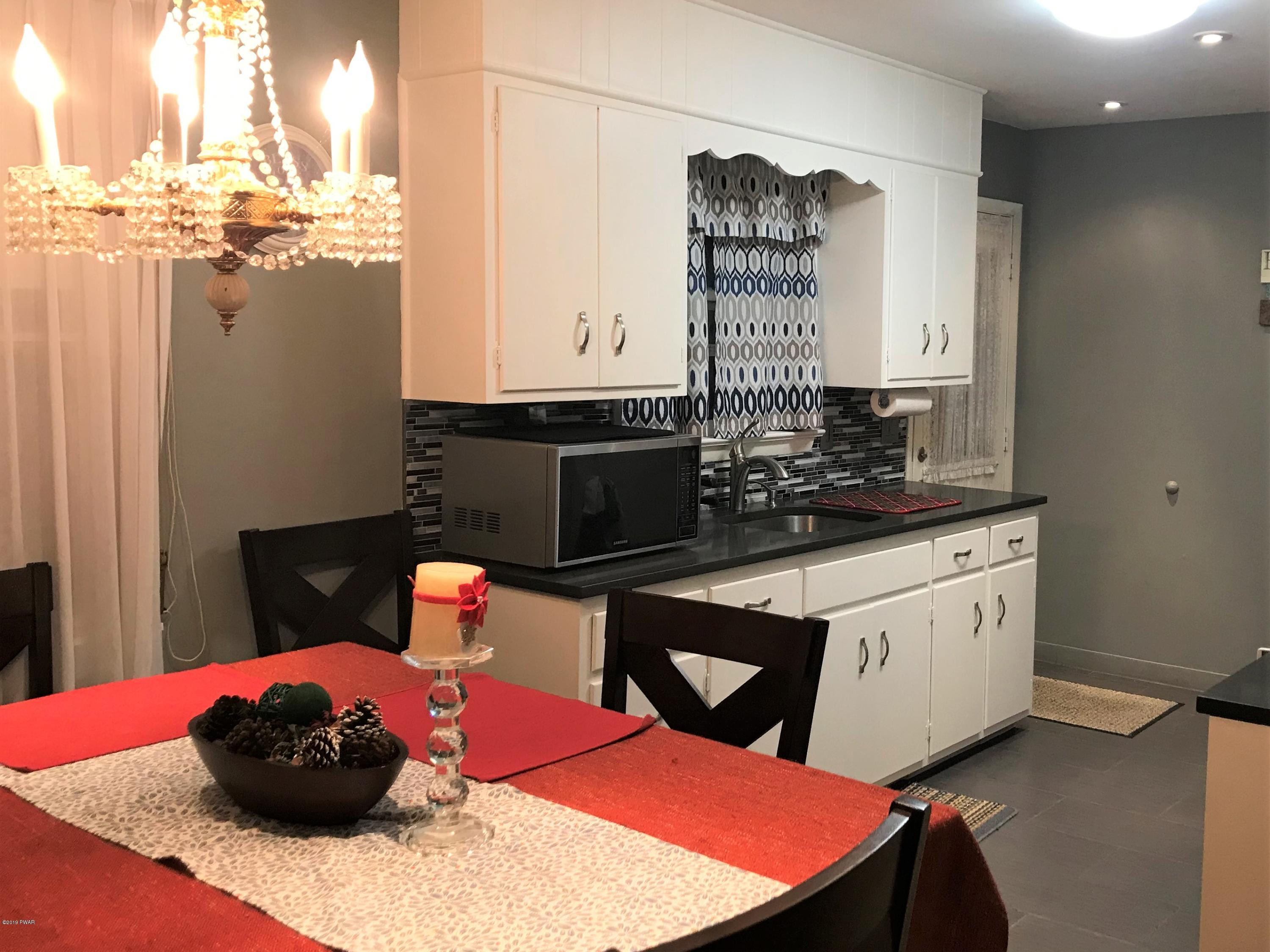 142 Kiel Road Milford, PA 18337 - Photo 10 of 34 a kitchen with stainless steel appliances kitchen island granite countertop a sink and cabinets