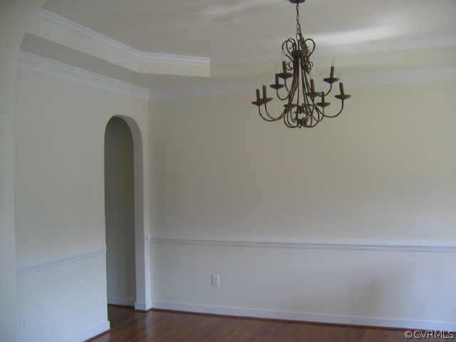 1213 Gravatt Way Midlothian, VA 23114 - Photo 2 of 9 a view of a room with rack and wooden floor