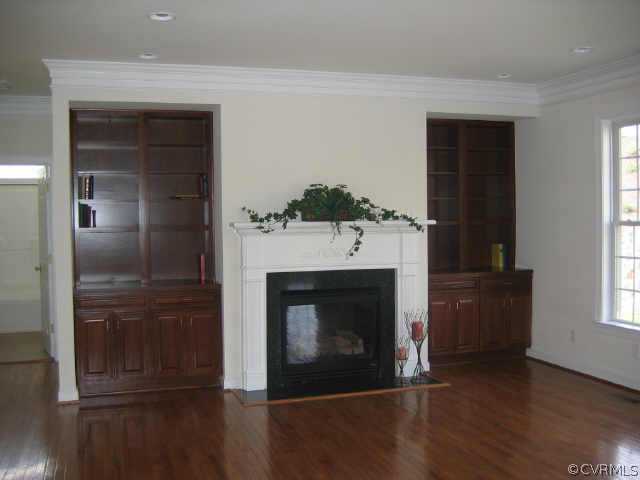 1213 Gravatt Way Midlothian, VA 23114 - Photo 4 of 9 a living room with a fireplace