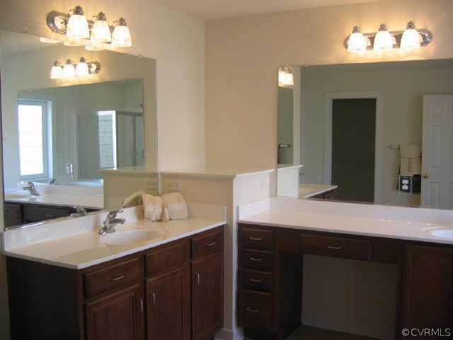 1213 Gravatt Way Midlothian, VA 23114 - Photo 9 of 9 a bathroom with a sink double vanity and a mirror