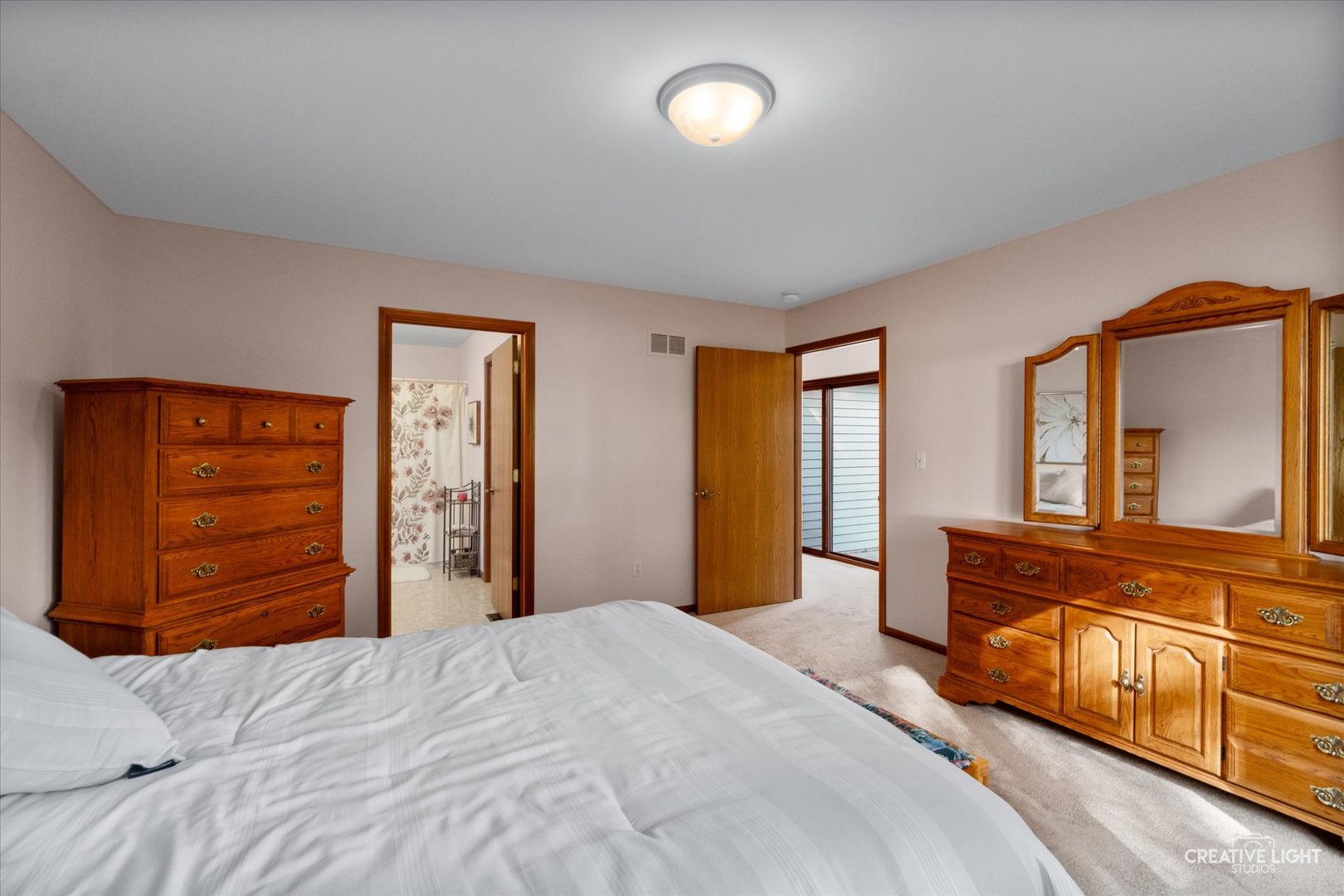 43 Juniper Drive North Aurora, IL 60542 - Photo 12 of 16 a bedroom with a bed and a large dresser