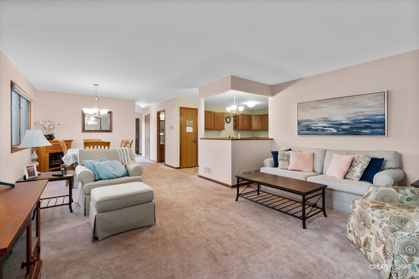 43 Juniper Drive North Aurora, IL 60542 - Photo 3 of 16 a living room with furniture and a dining table with kitchen view