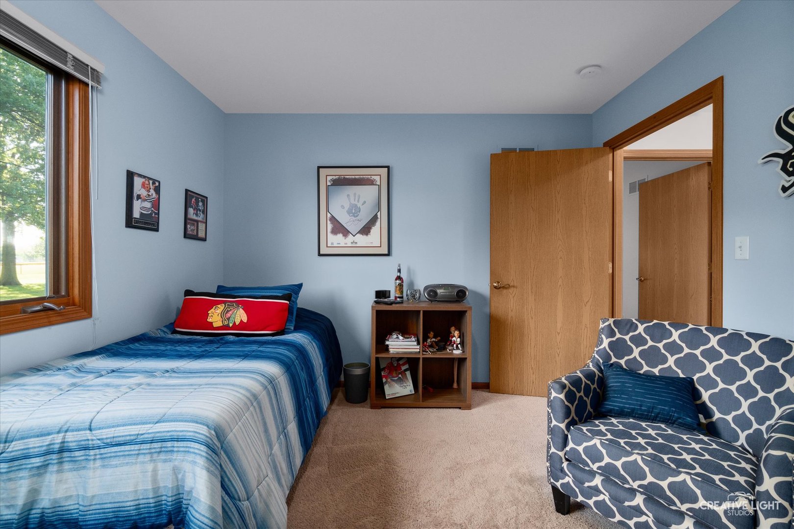 43 Juniper Drive North Aurora, IL 60542 - Photo 10 of 16 a bedroom with a bed and a dresser next to a window