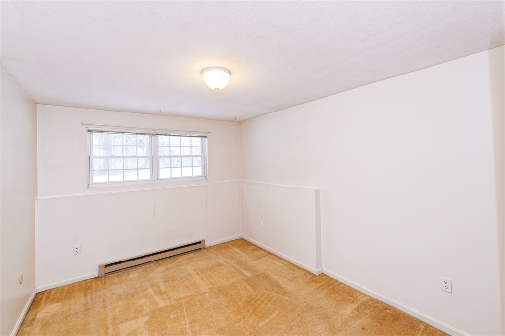 39 Pleasant Street, Unit B4 Northborough, MA 01532 - Photo 11 of 24 an empty room with a window