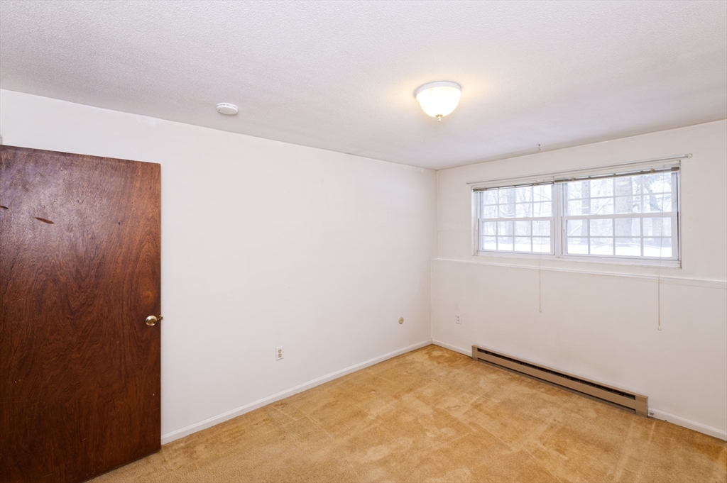 39 Pleasant Street, Unit B4 Northborough, MA 01532 - Photo 13 of 24 an empty room with a window