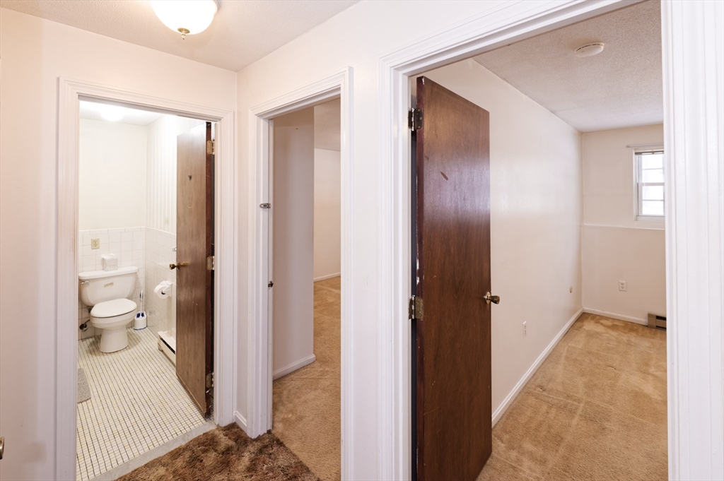 39 Pleasant Street, Unit B4 Northborough, MA 01532 - Photo 19 of 24 a bathroom with a sink and a toilet