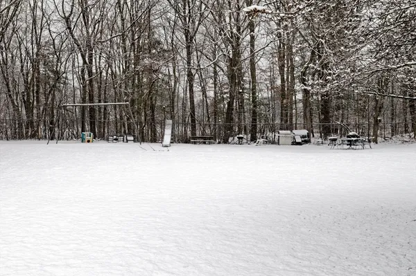 a view of outdoor space with wooden fence