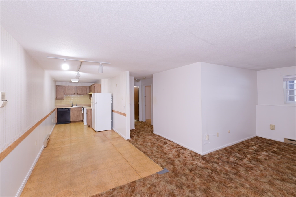 39 Pleasant Street, Unit B4 Northborough, MA 01532 - Photo 7 of 24 a view of a big room with closet and windows