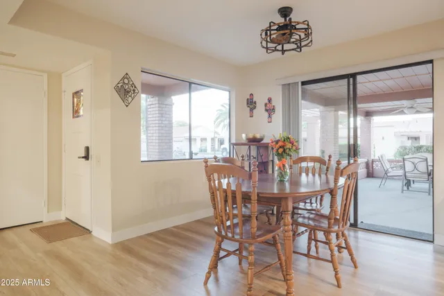 a view of a dining room with furniture window and outside view