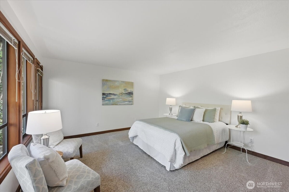 9418 Odin Way Bothell, WA 98011 - Photo 34 of 39 a bedroom with a bed and a lamp with window