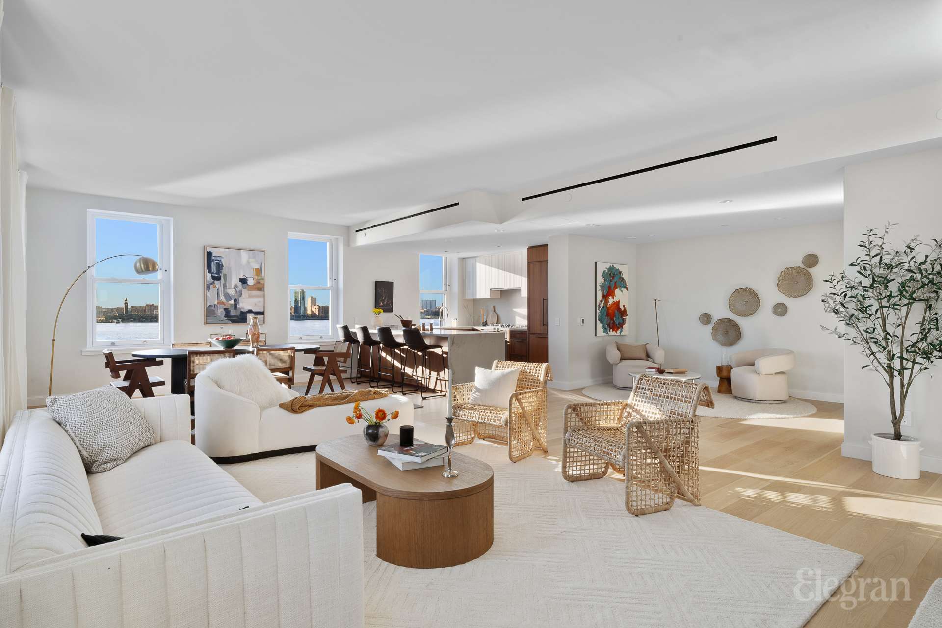 150 Barrow Street, Unit PHA Manhattan, NY 10014 - Photo 8 of 22 a living room with lots of white furniture and a painting on the wall