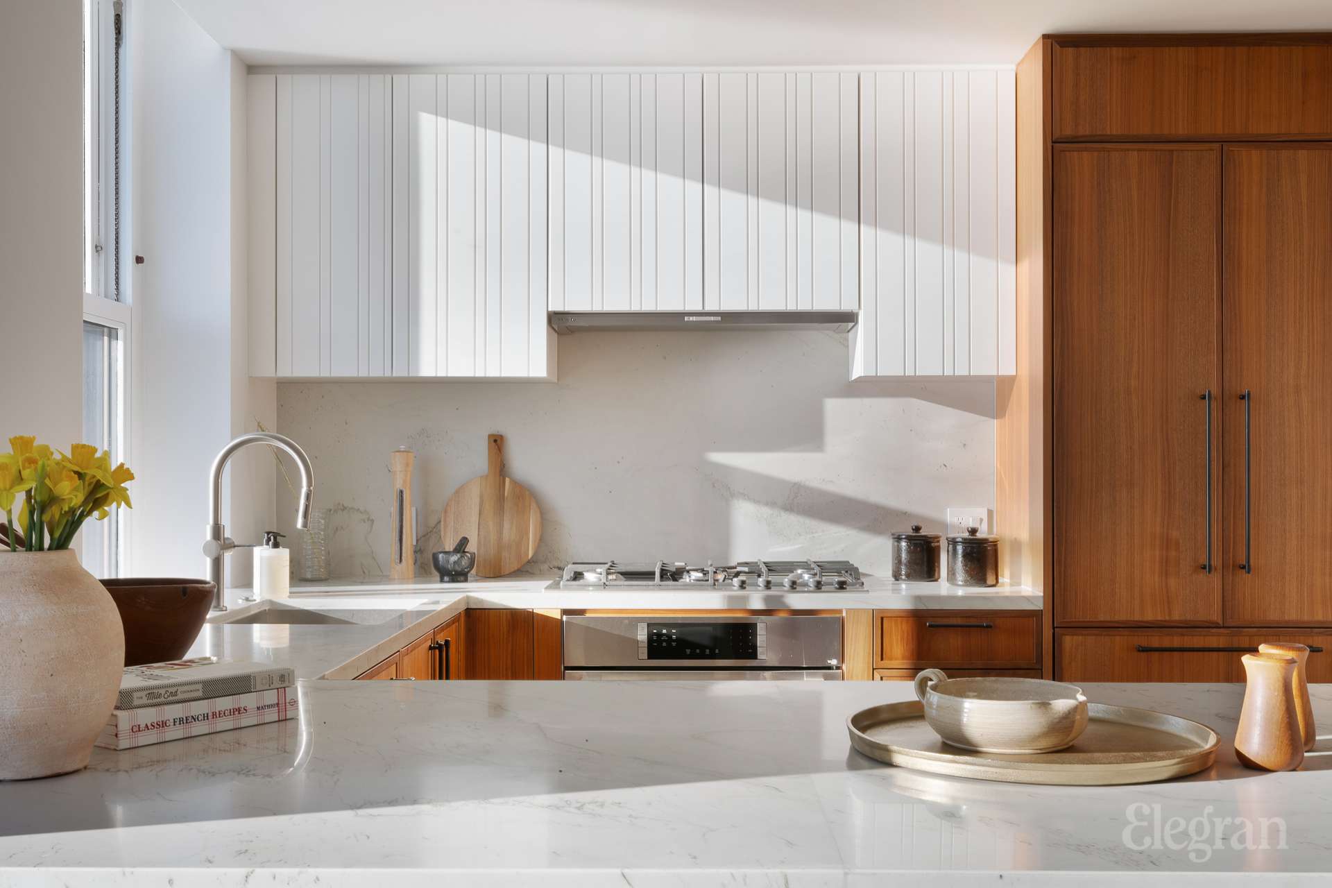 150 Barrow Street, Unit PHA Manhattan, NY 10014 - Photo 10 of 22 a kitchen with stainless steel appliances a sink a counter space and cabinets