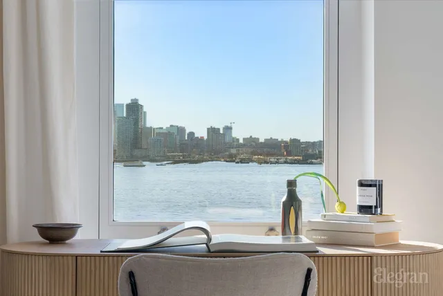 a kitchen with a dining table chairs and refrigerator