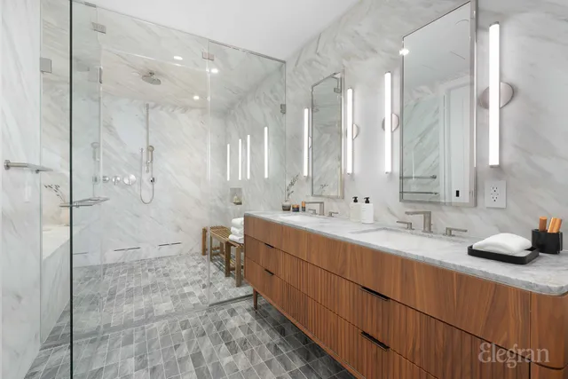 a kitchen with stainless steel appliances a sink a counter space and cabinets