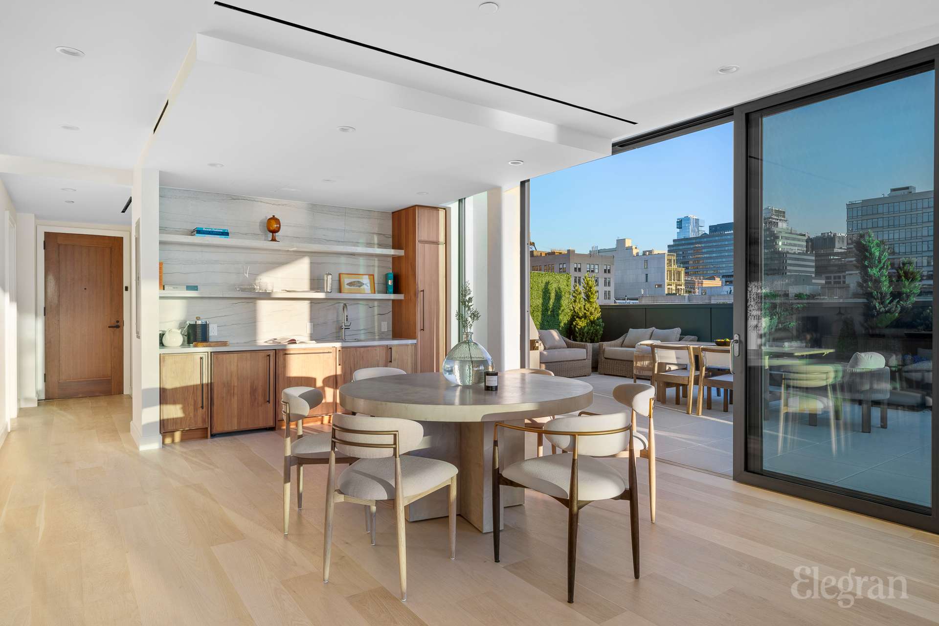 150 Barrow Street, Unit PHA Manhattan, NY 10014 - Photo 4 of 22 a view of a dining room with furniture window and wooden floor