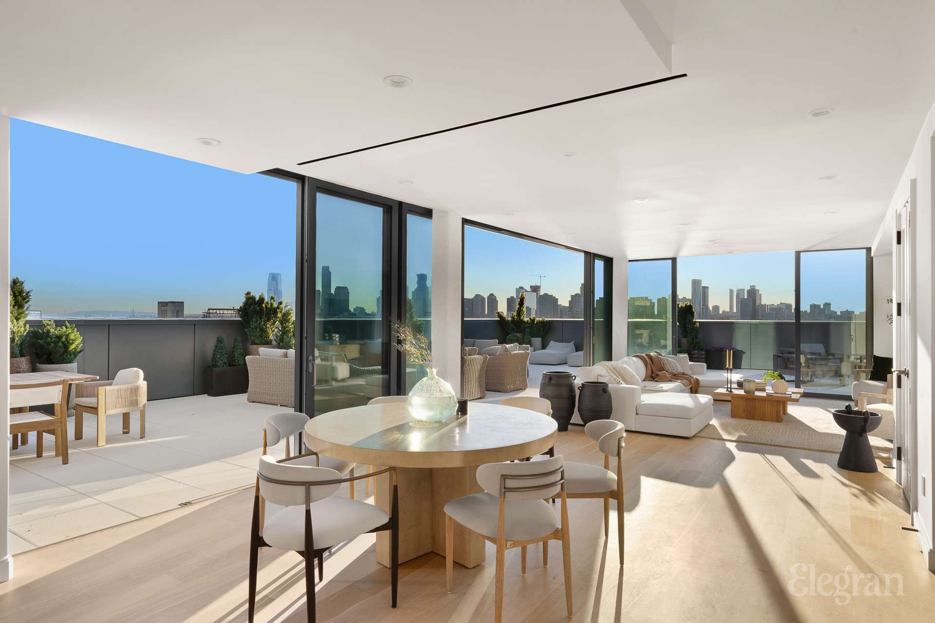 150 Barrow Street, Unit PHA Manhattan, NY 10014 - Photo 5 of 22 a living room with furniture and large windows
