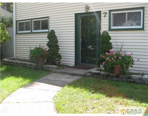 7 Ridge Road Old Bridge, NJ 08857 - Photo 3 of 15 a front view of a house with garden