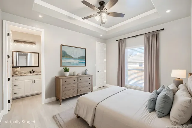 a view of an empty room with a ceiling fan