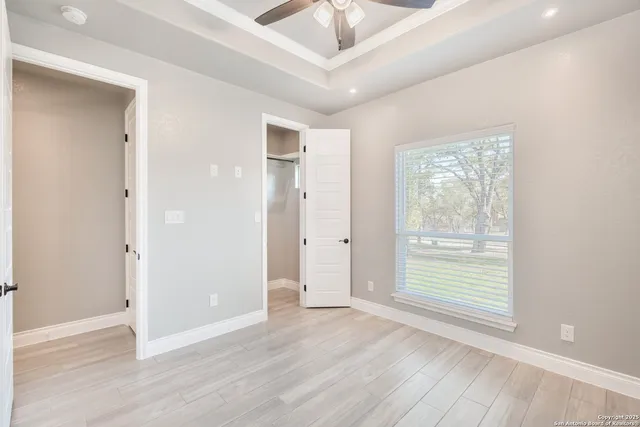 a bathroom with double vanity sinks and a mirror