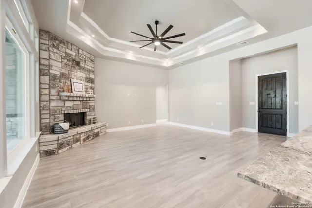 a view of kitchen with furniture and a fireplace