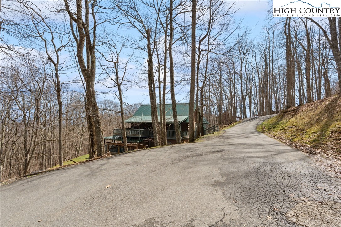 1748 Junaluska Road Boone, NC 28607 - Photo 33 of 37 a view of a street with trees on both side of it